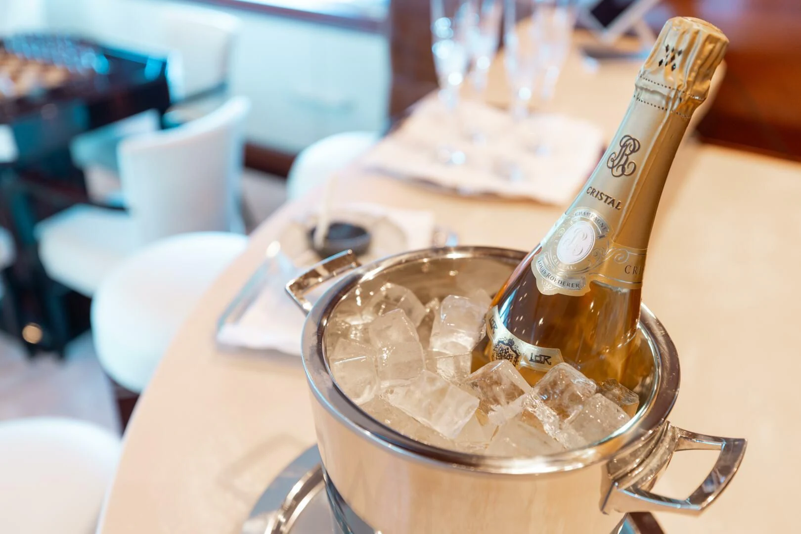a bottle of alcohol on a table aboard LADY B Yacht for Charter