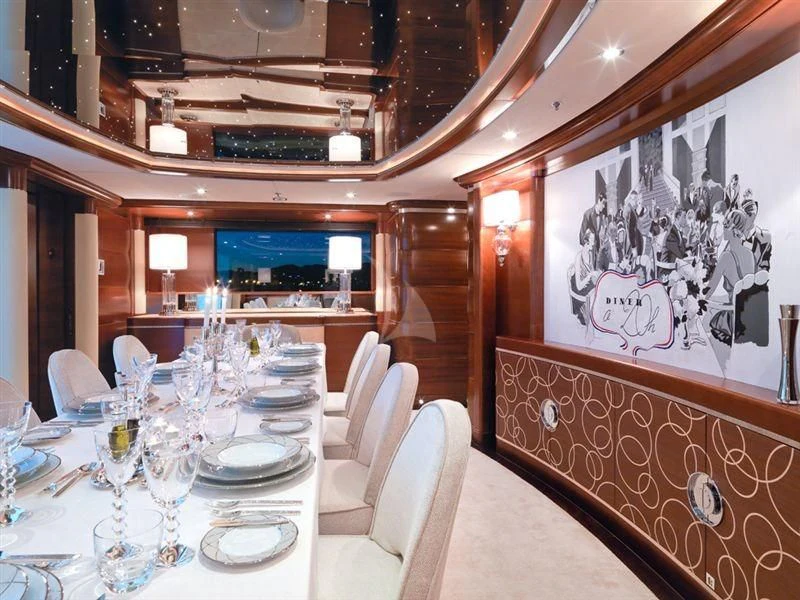 a dining room with tables and chairs aboard LADY B Yacht for Charter