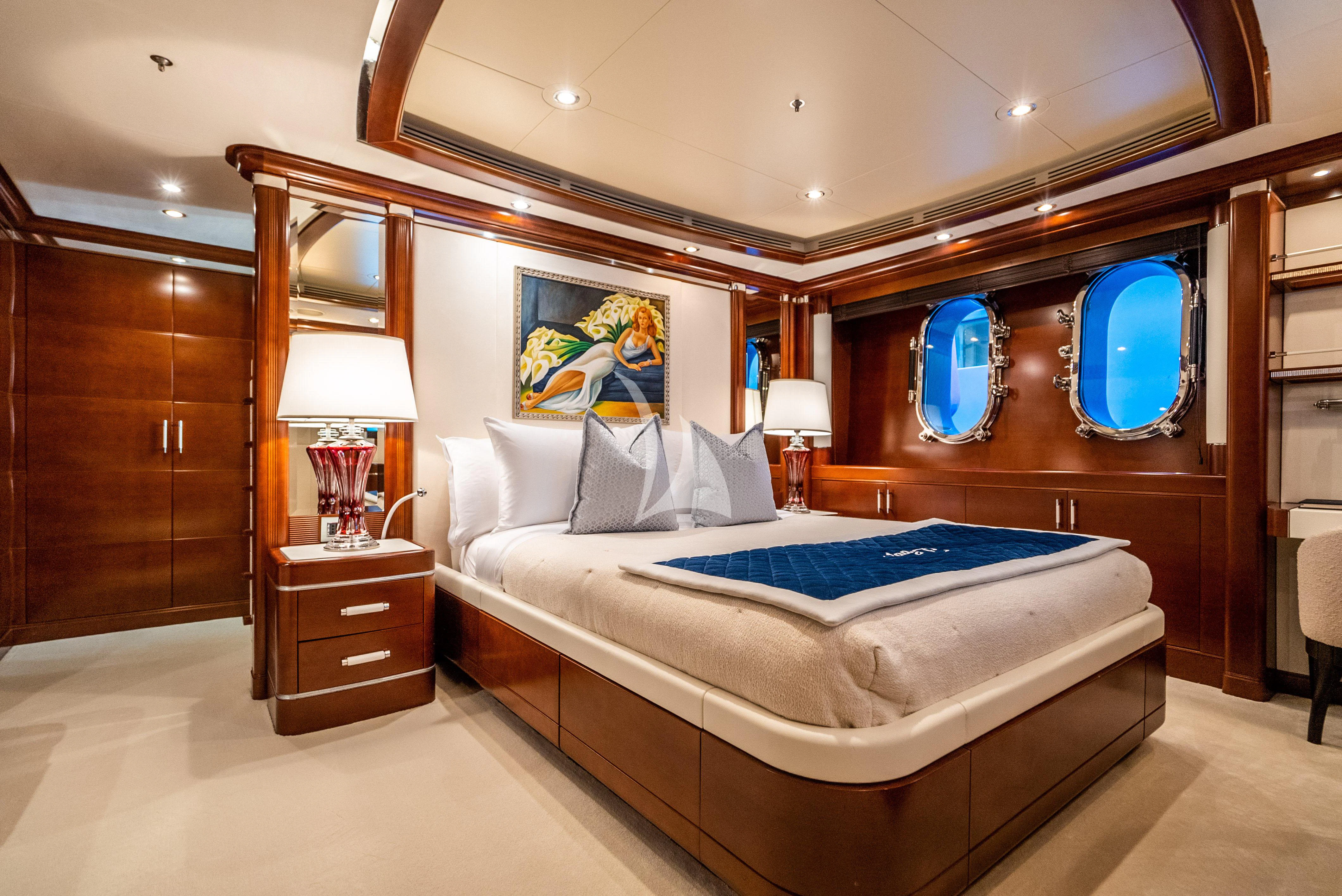 a bedroom with a large bed aboard LADY B Yacht for Charter