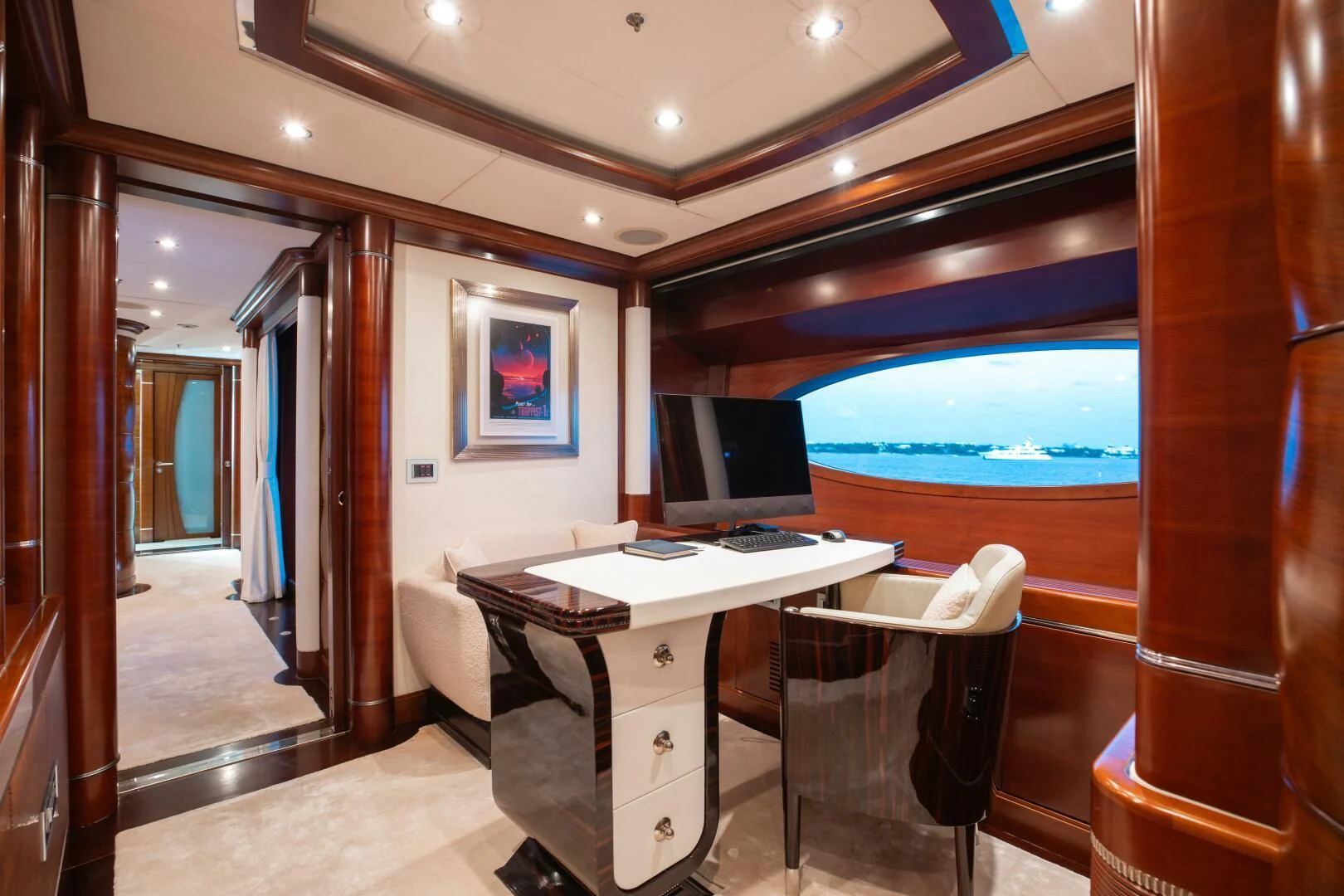 a room with a desk and a window aboard LADY B Yacht for Charter