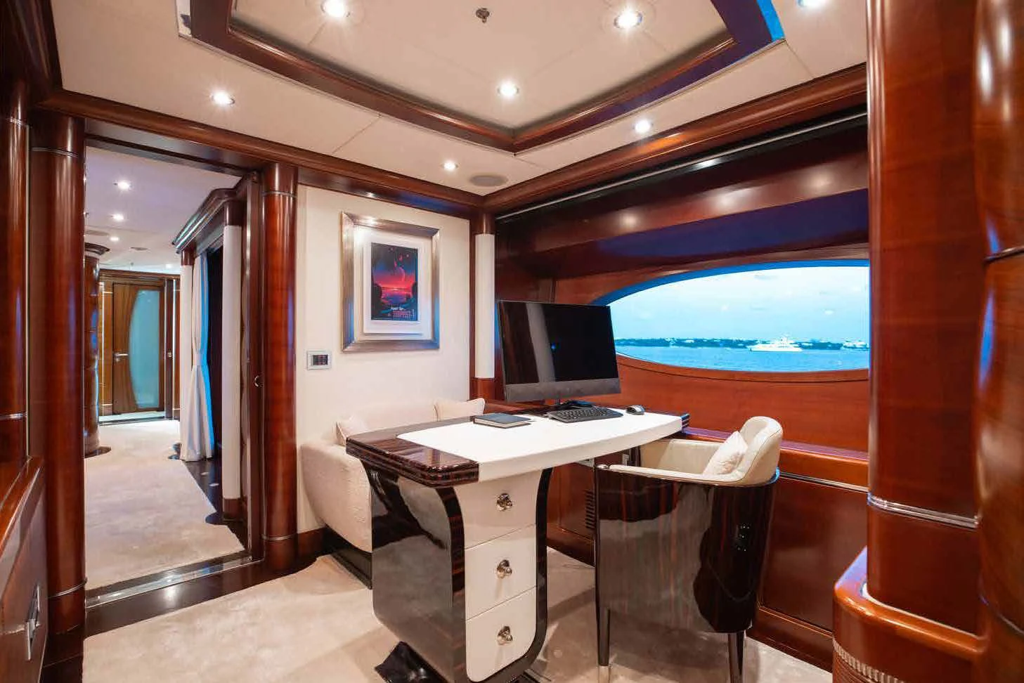 a room with a desk and a computer aboard LADY B Yacht for Charter