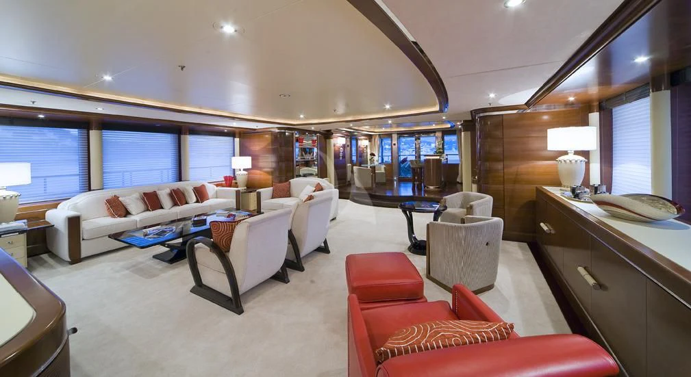 a room with a bed and a desk aboard LADY B Yacht for Charter