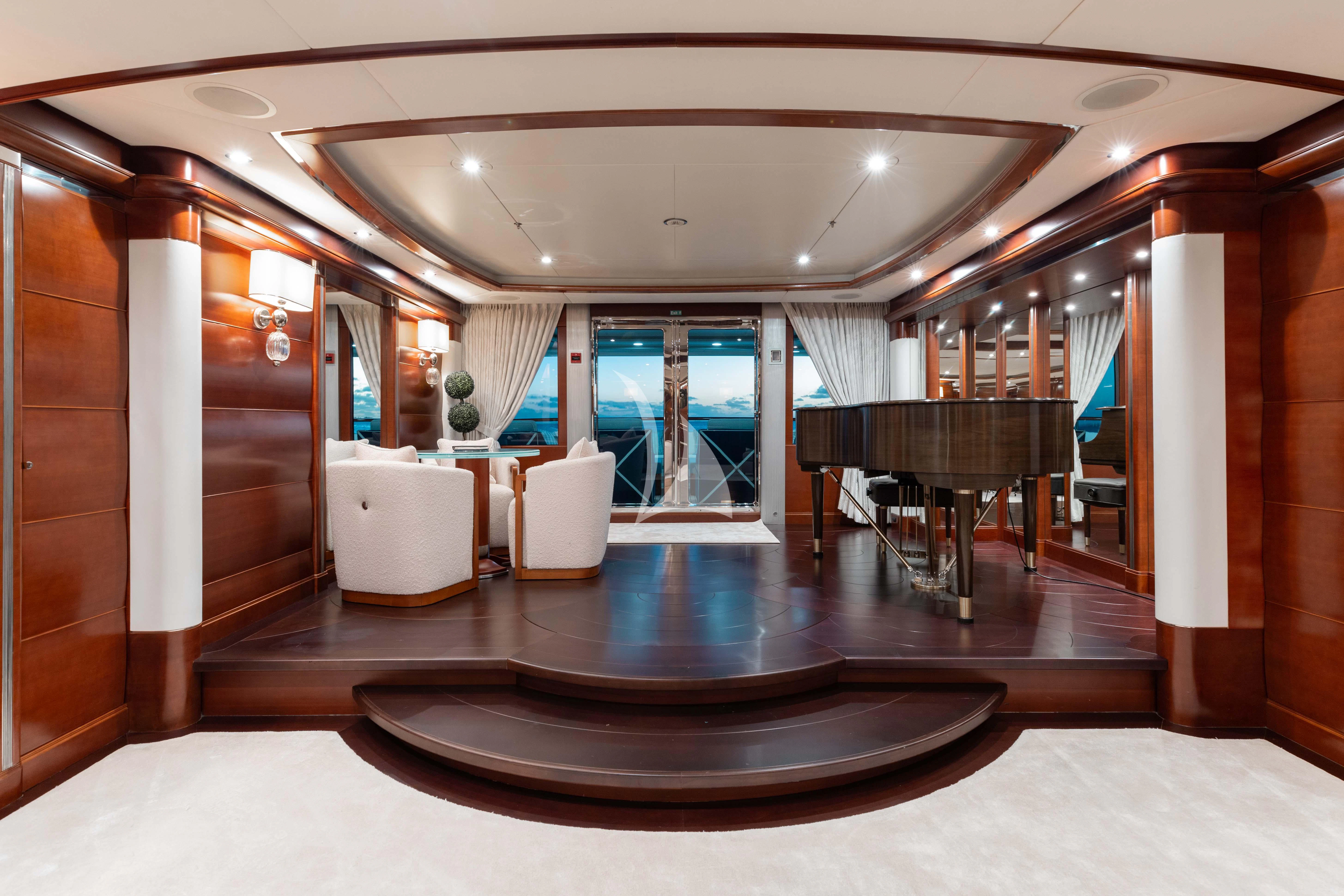 a room with a large mirror and a table aboard LADY B Yacht for Charter
