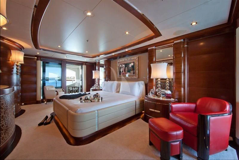 a bedroom with a large bed aboard LADY B Yacht for Charter