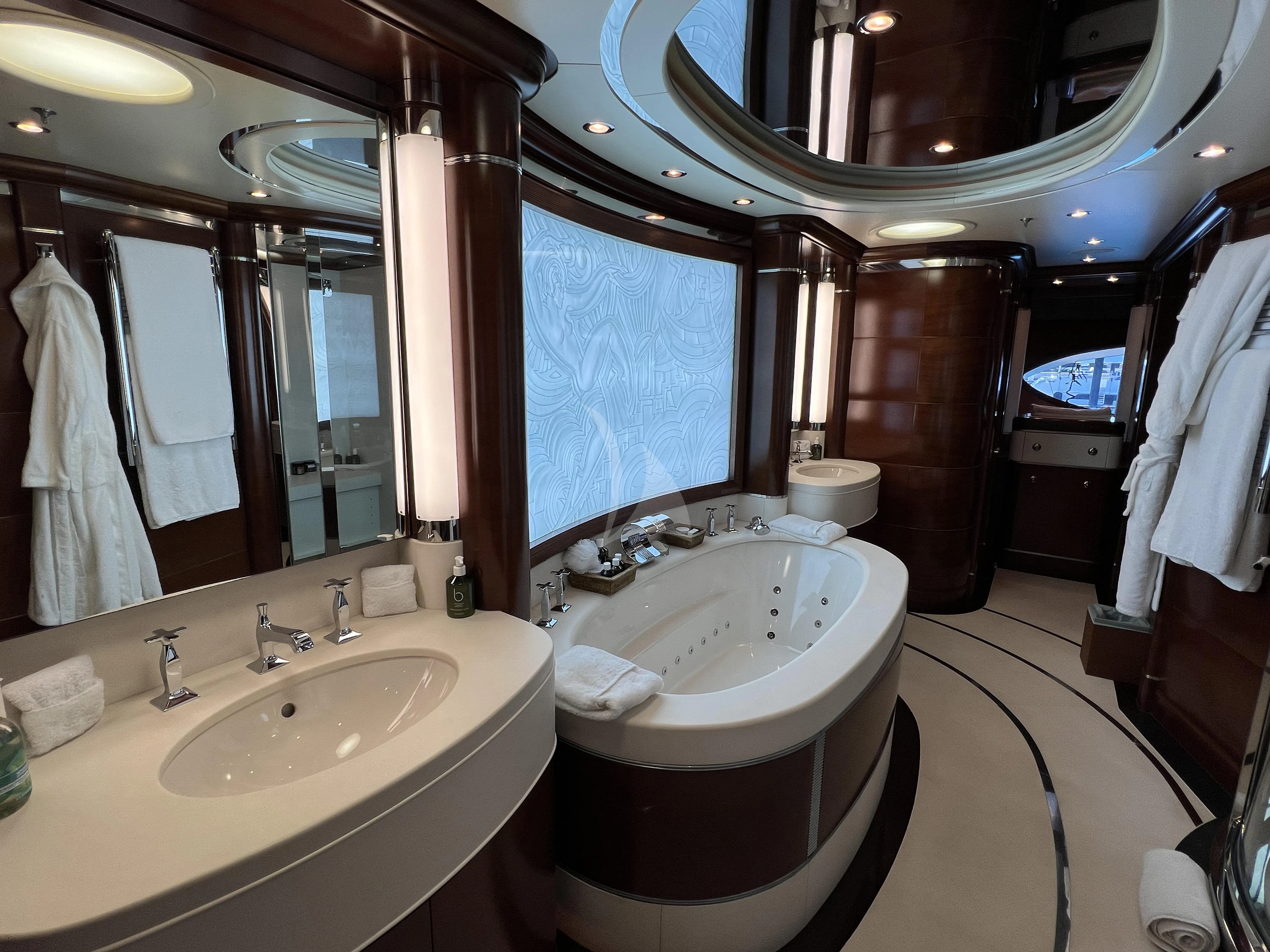 a bathroom with a large mirror aboard LADY B Yacht for Charter