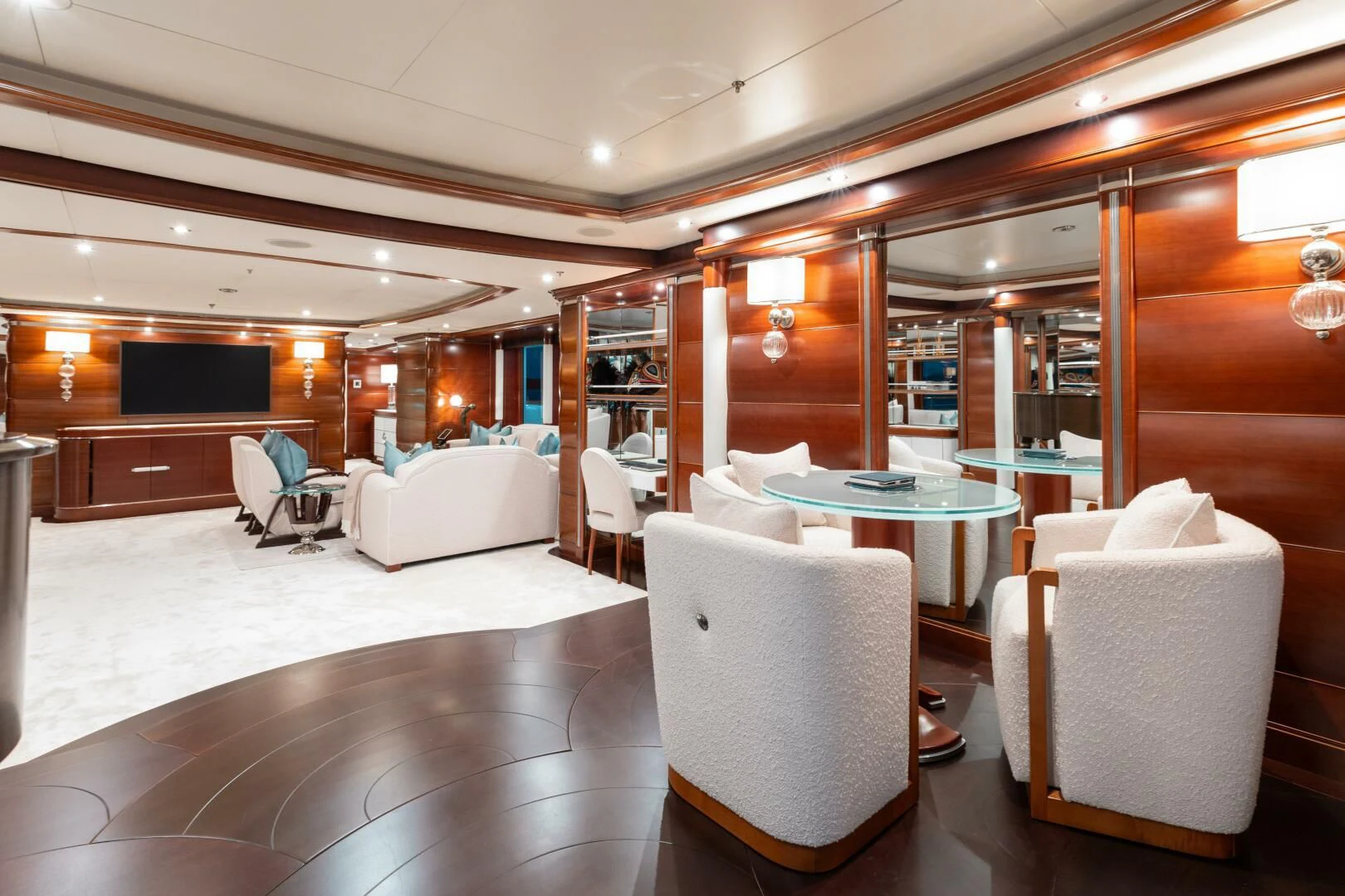 a room with a table chairs and a couch aboard LADY B Yacht for Charter