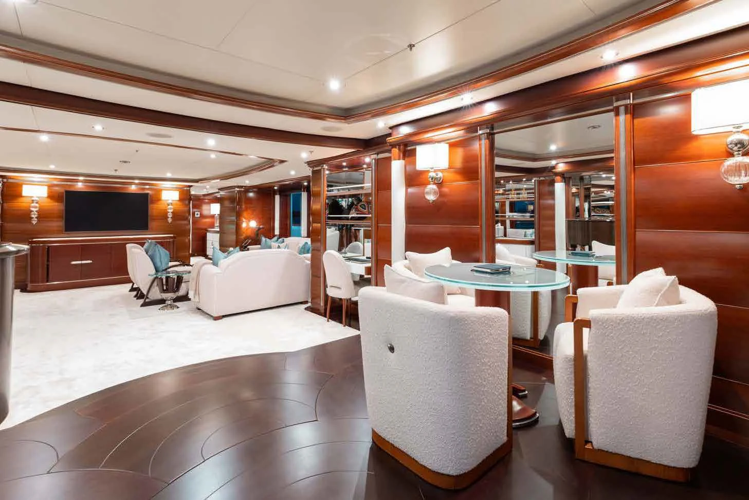 a room with a table chairs and a couch aboard LADY B Yacht for Charter
