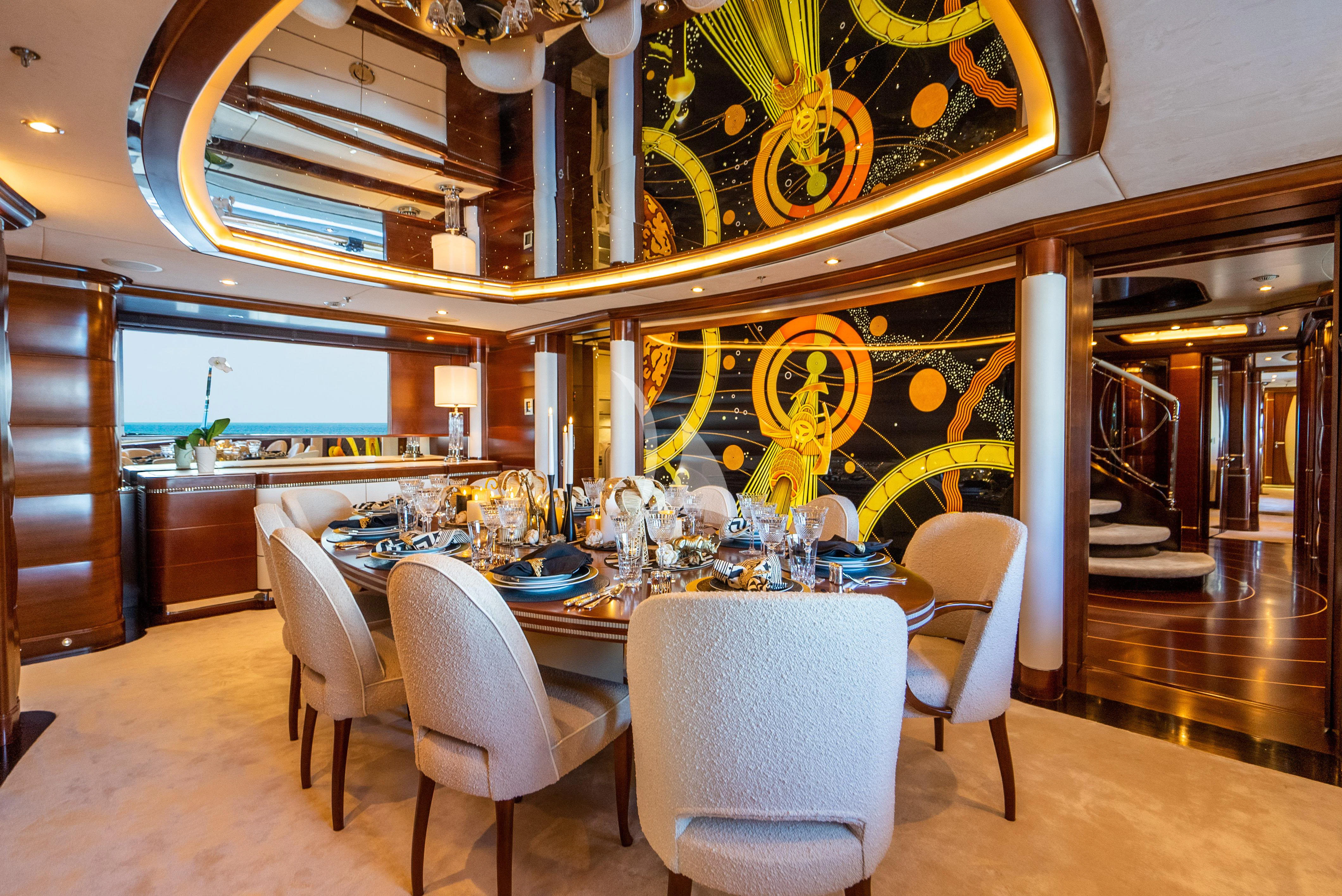 a dining room with a table and chairs aboard LADY B Yacht for Charter