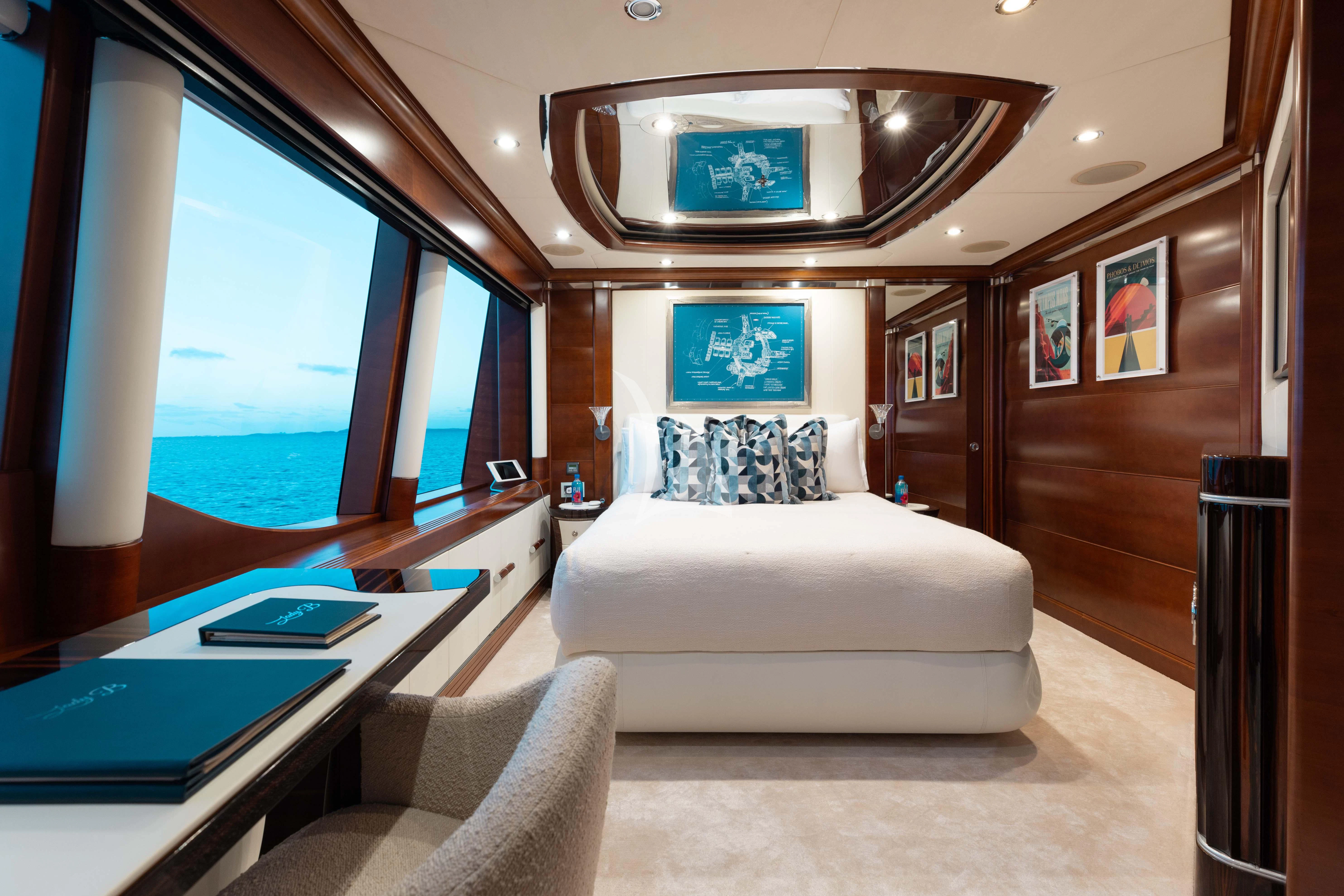 a room with a couch and a table and a window aboard LADY B Yacht for Charter