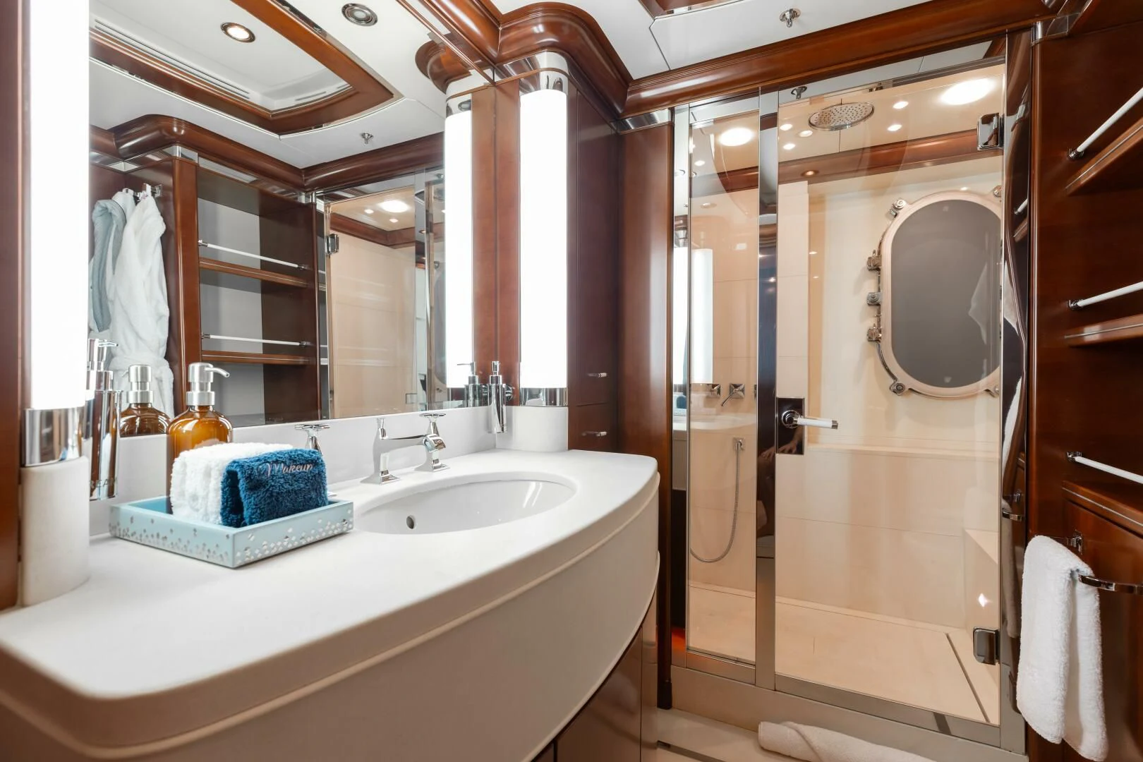 a bathroom with a large mirror aboard LADY B Yacht for Charter