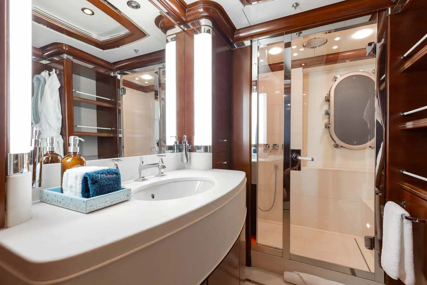 a bathroom with a large mirror aboard LADY B Yacht for Charter