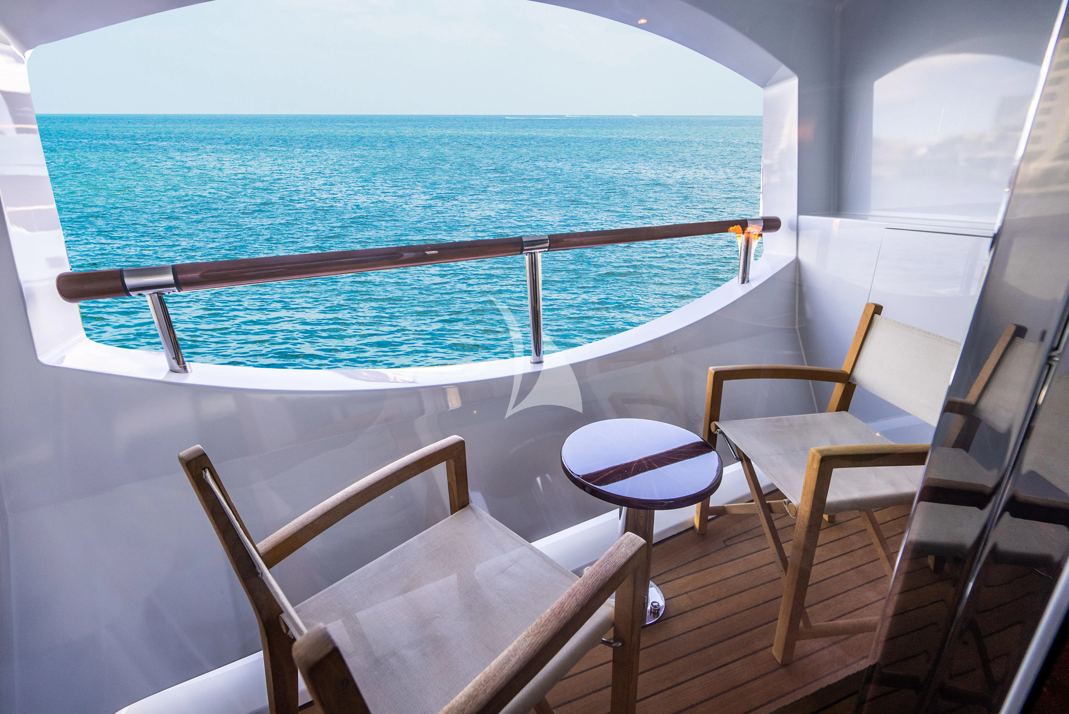 a deck with chairs and a railing aboard LADY B Yacht for Charter