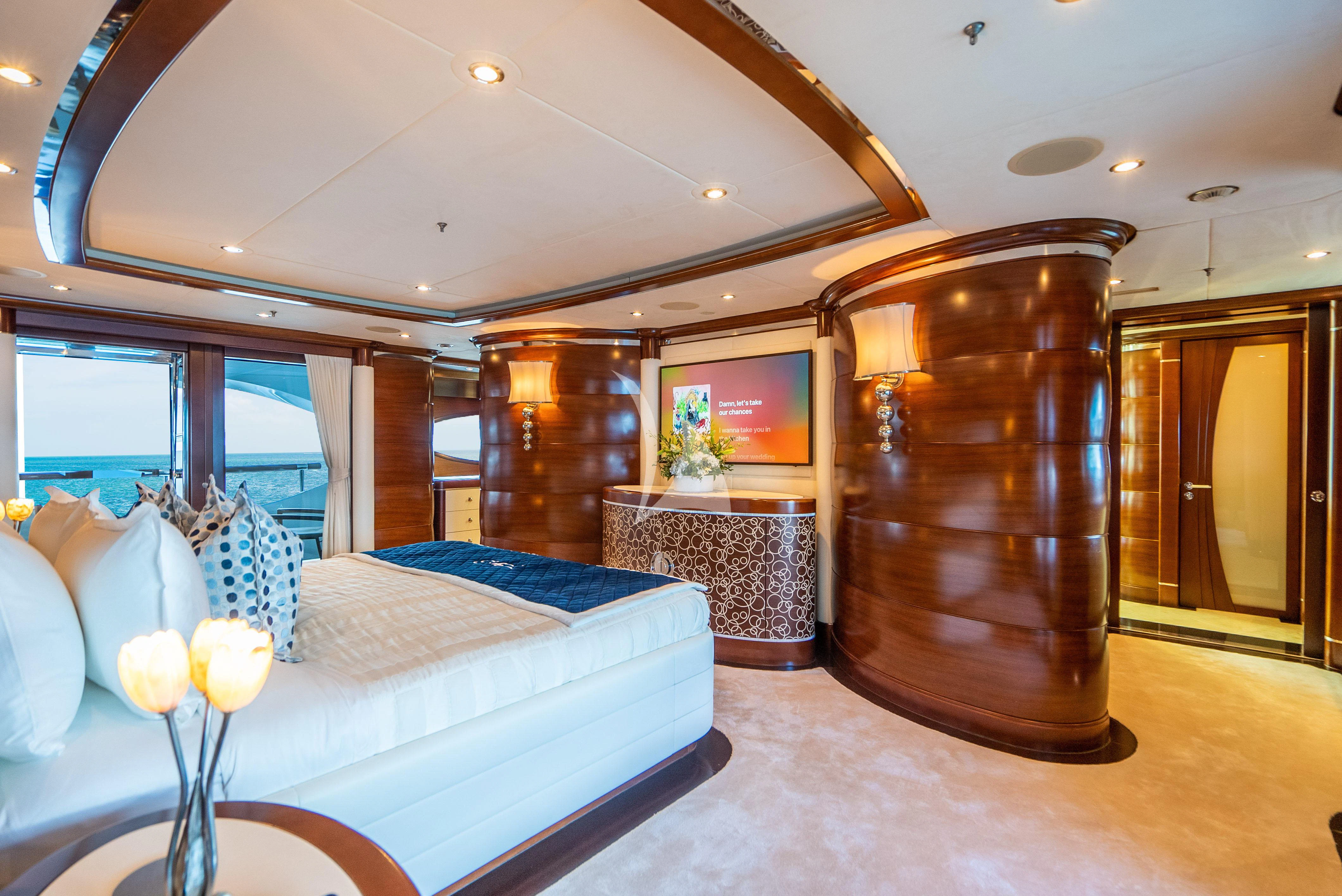 a large bedroom with a large wood cabinet aboard LADY B Yacht for Charter