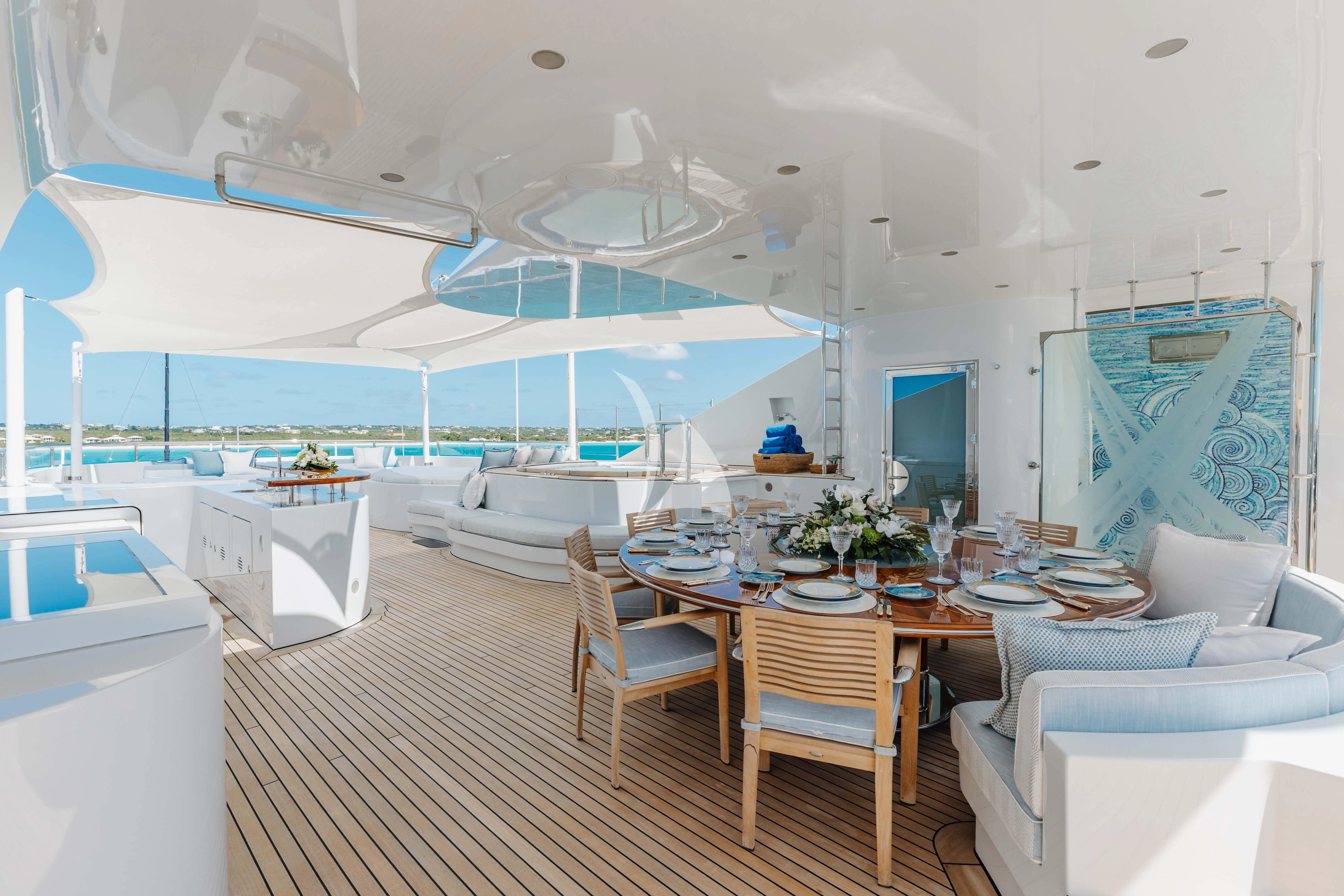 a room with a table and chairs aboard LADY B Yacht for Charter