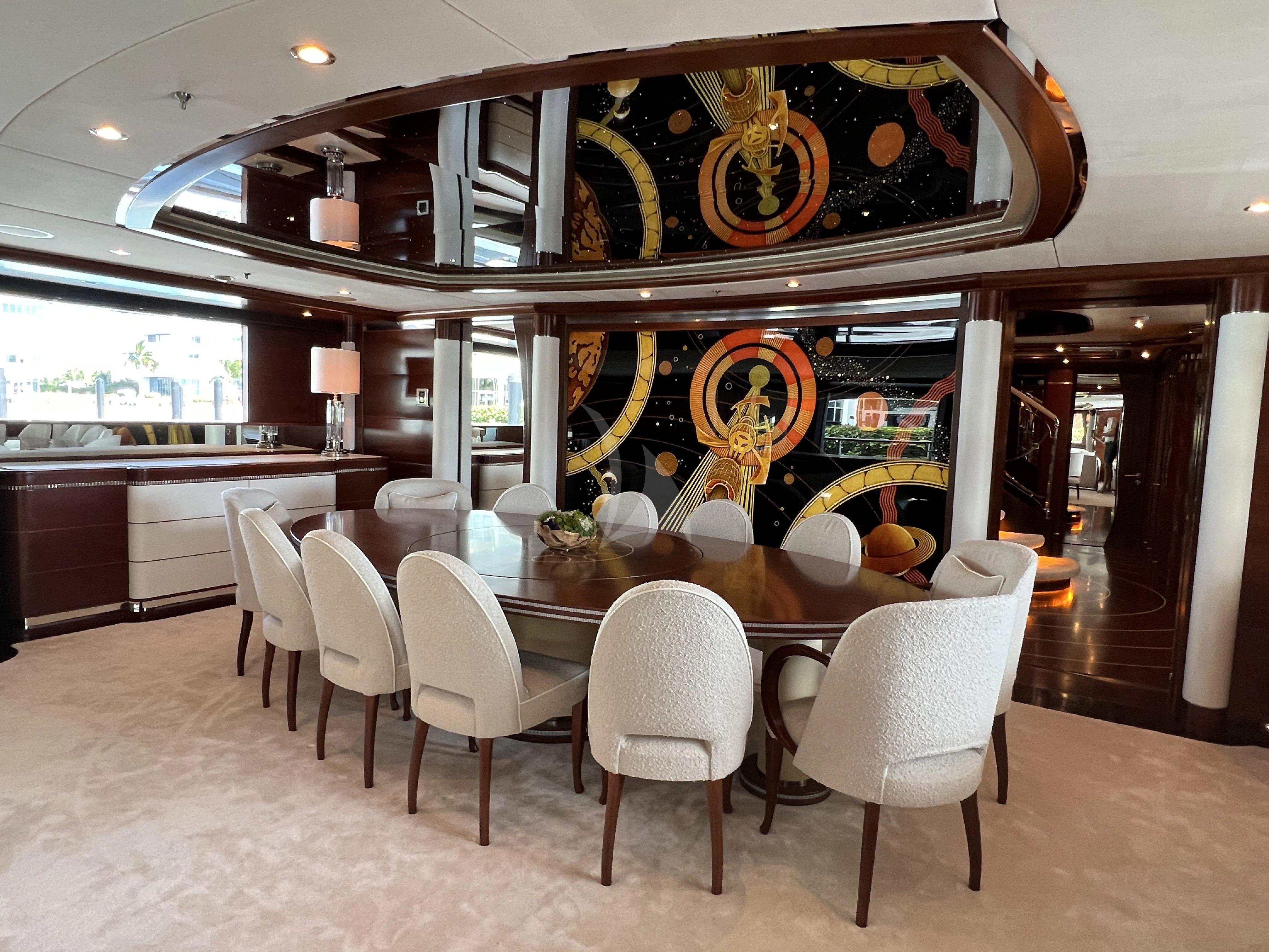 a large kitchen with a table and chairs aboard LADY B Yacht for Charter