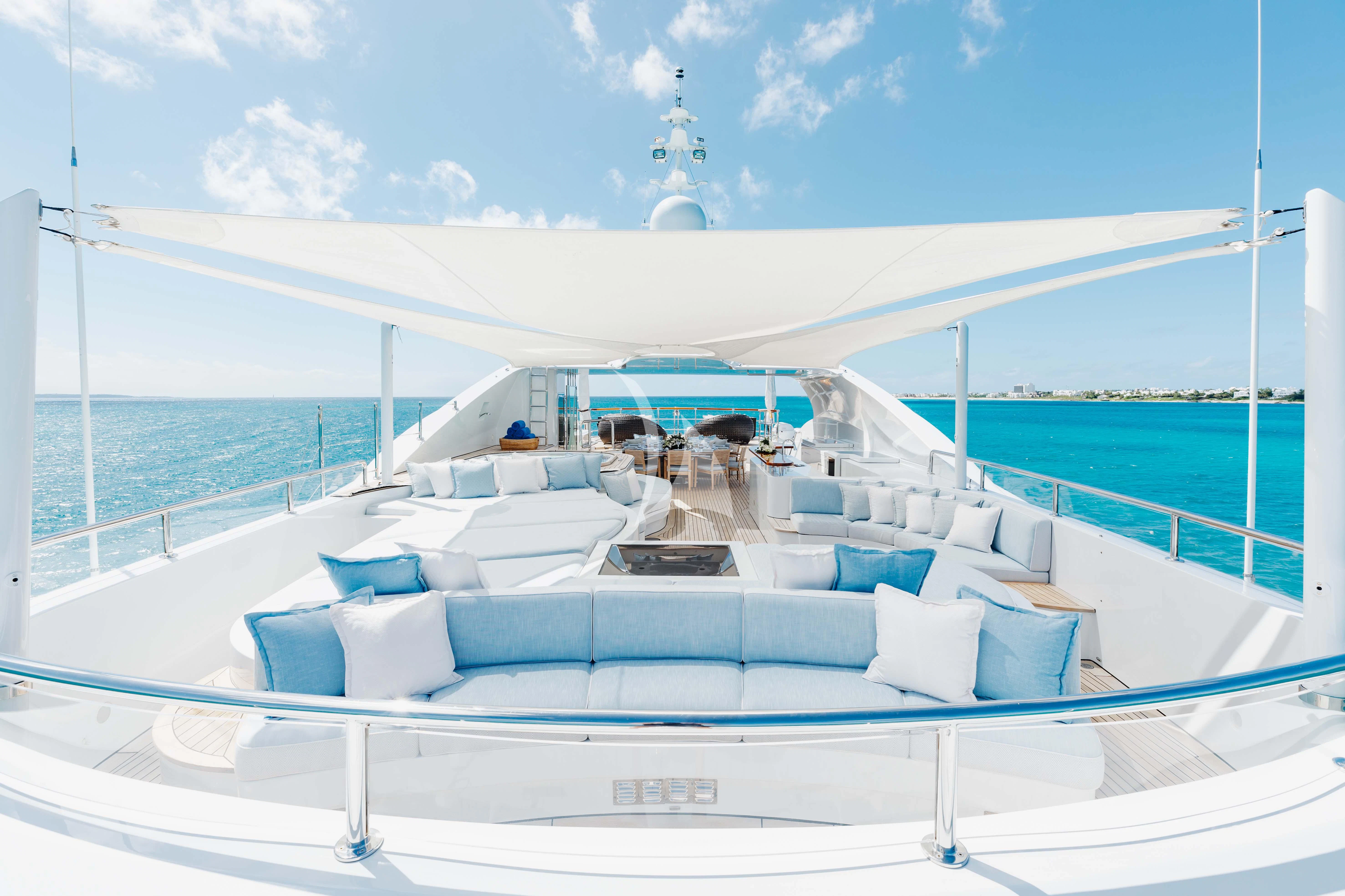 a large white boat on a body of water aboard LADY B Yacht for Charter