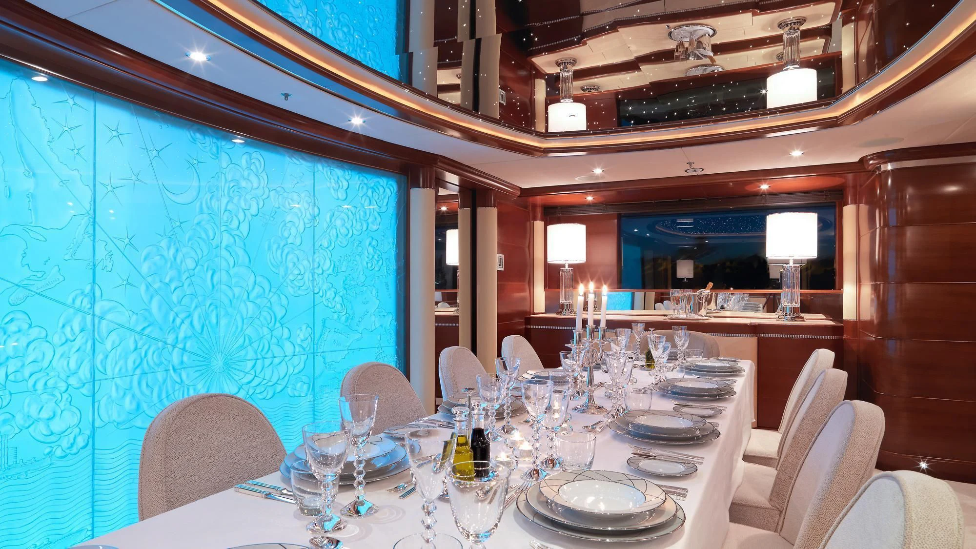 a room with a table set for a dinner party aboard LADY B Yacht for Charter