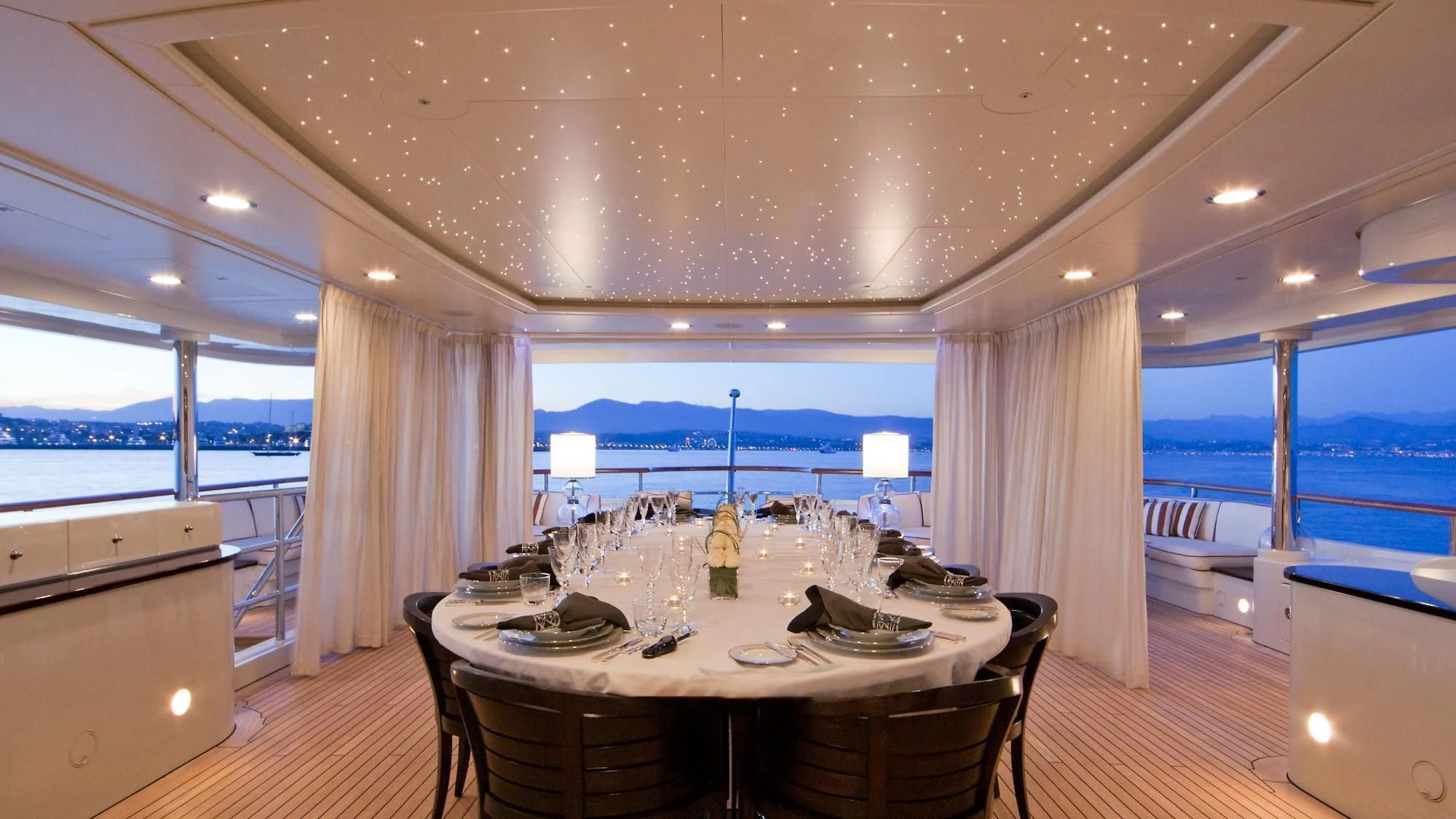 a large dining table in a room aboard LADY B Yacht for Charter