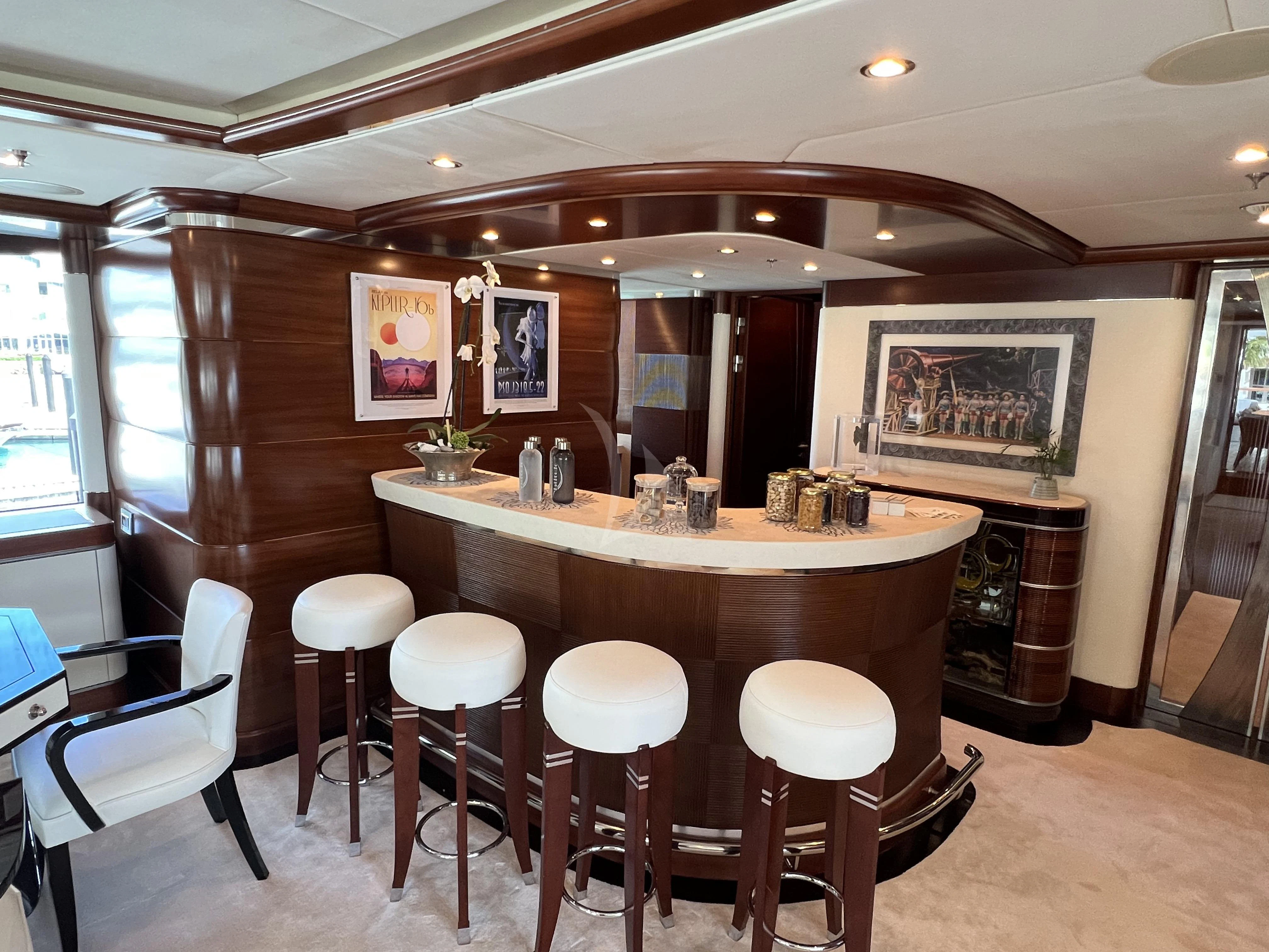 a bar with stools and tables aboard LADY B Yacht for Charter