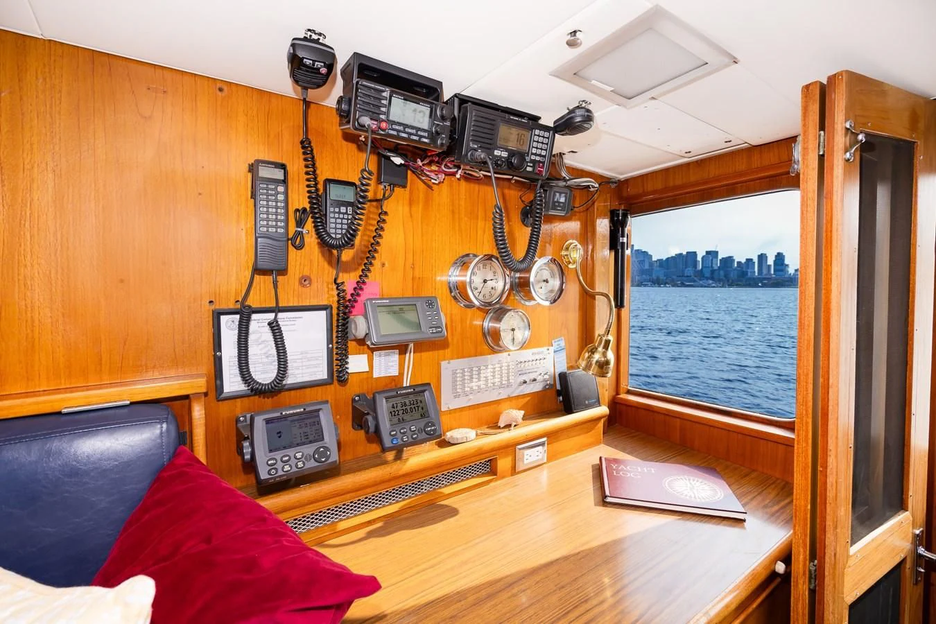 a wooden boat with a desk and computer equipment aboard SEA STAR Yacht for Sale