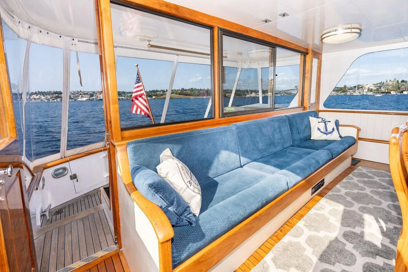 a blue couch in a boat aboard SEA STAR Yacht for Sale