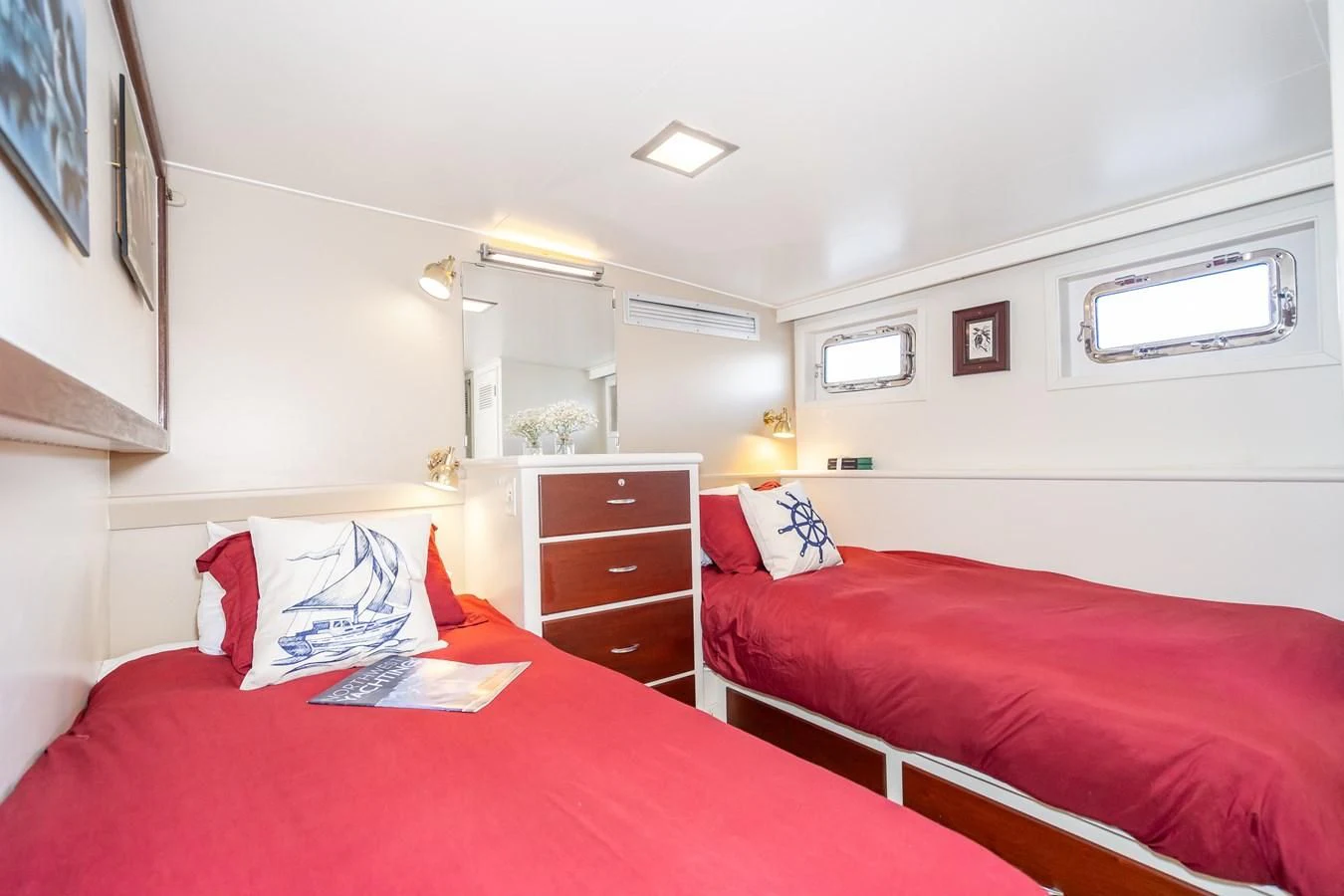 a room with two beds aboard SEA STAR Yacht for Sale
