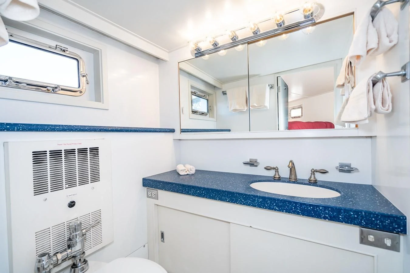 a bathroom with a sink and a mirror aboard SEA STAR Yacht for Sale