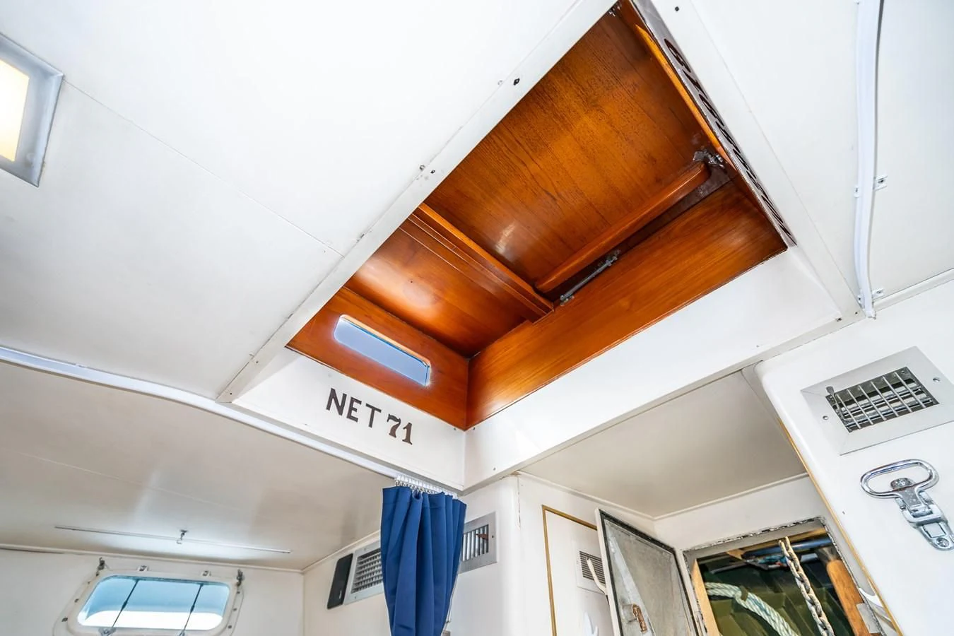 a wooden ceiling with a sign on it aboard SEA STAR Yacht for Sale