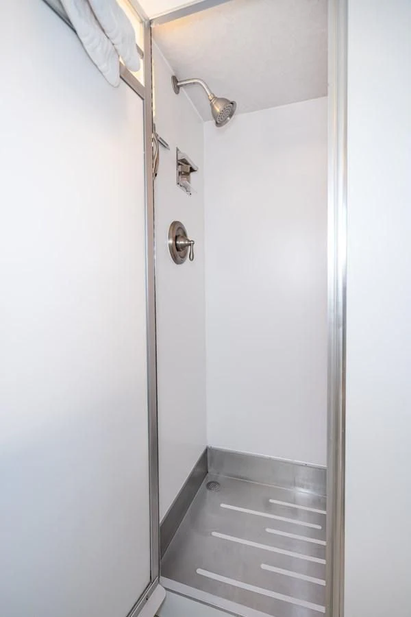 a white door with a handle aboard SEA STAR Yacht for Sale