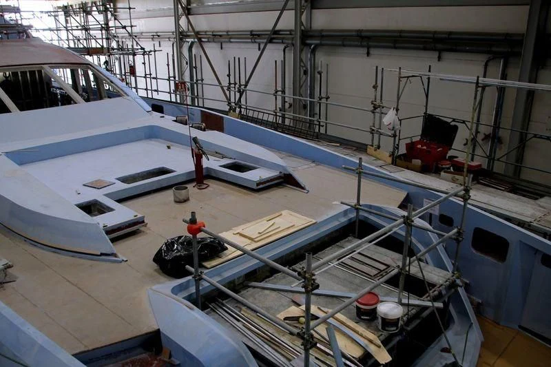 several boats are parked in a large room aboard FLYING DAGGER III Yacht for Sale