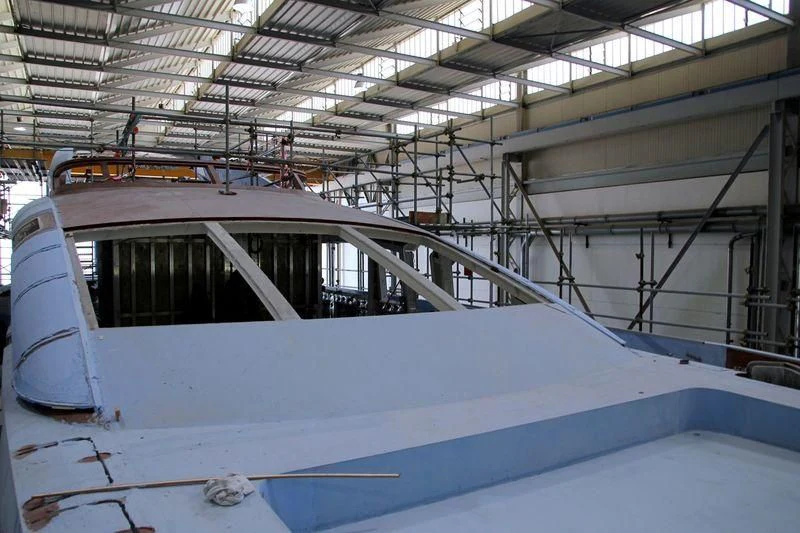 a large white machine in a warehouse aboard FLYING DAGGER III Yacht for Sale