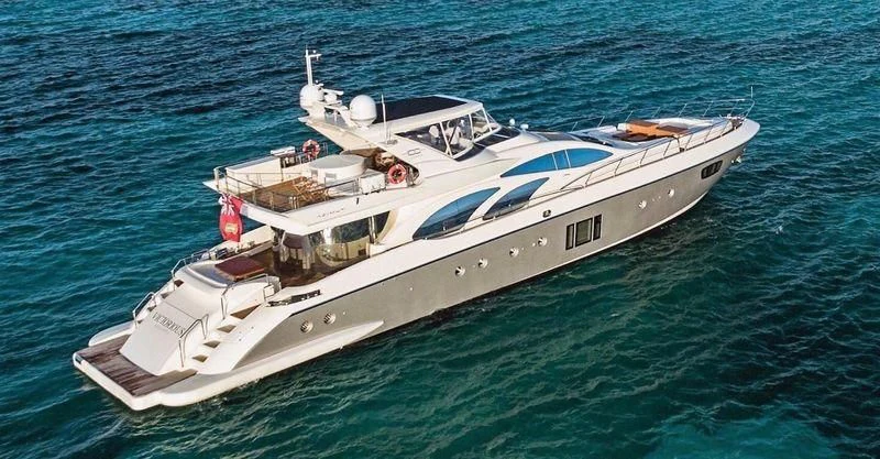a white boat in the water aboard VICTORIOUS Yacht for Sale