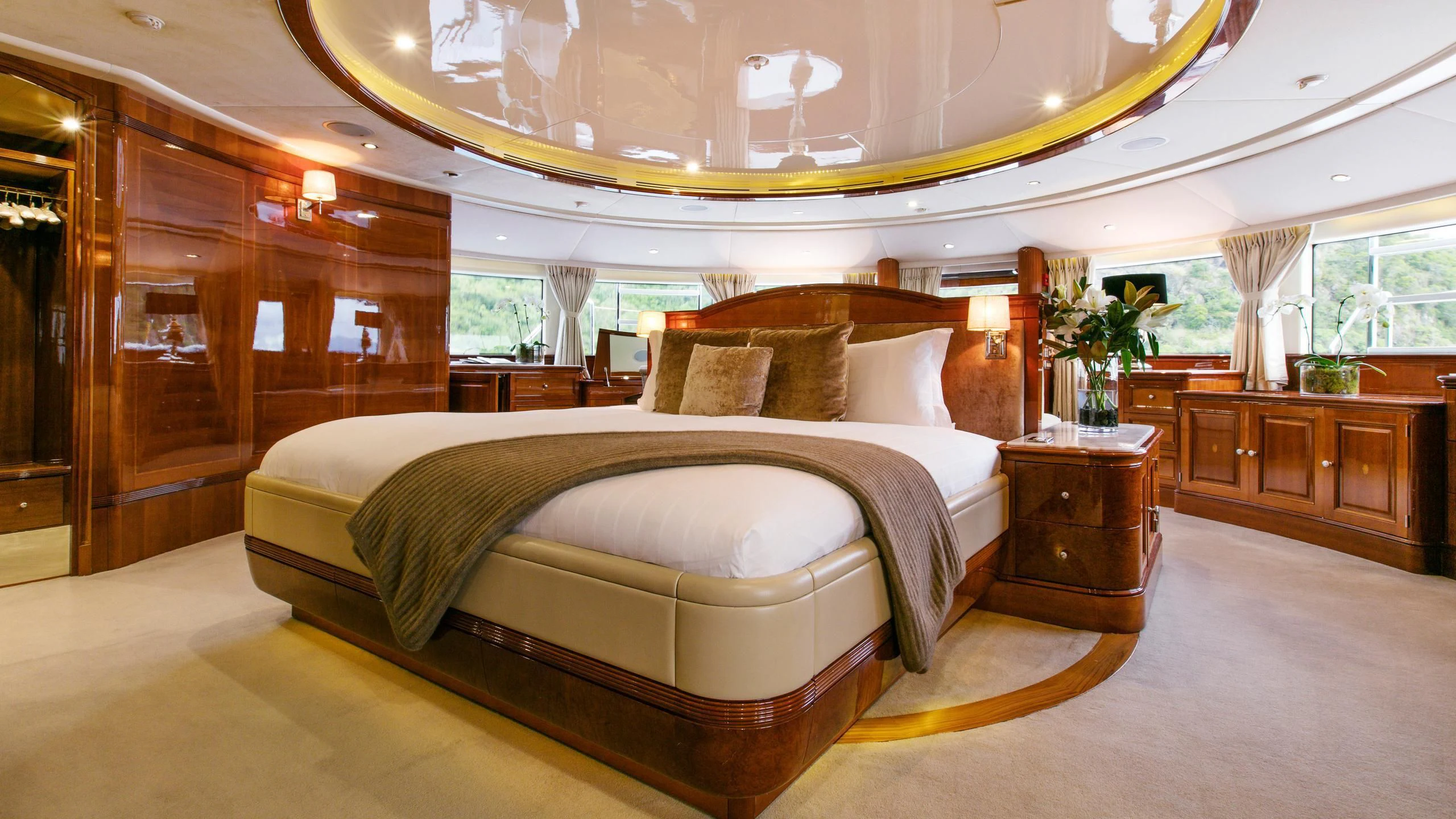 a large bed in a room aboard THE STAR Yacht for Sale
