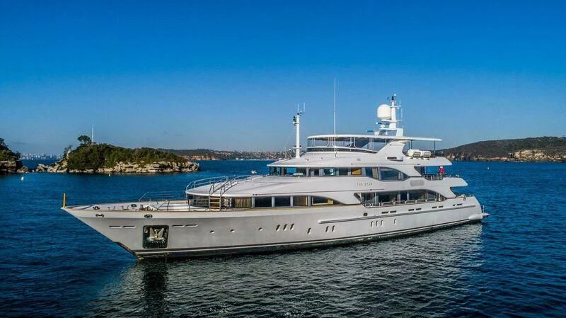 a large white boat in the water aboard THE STAR Yacht for Sale
