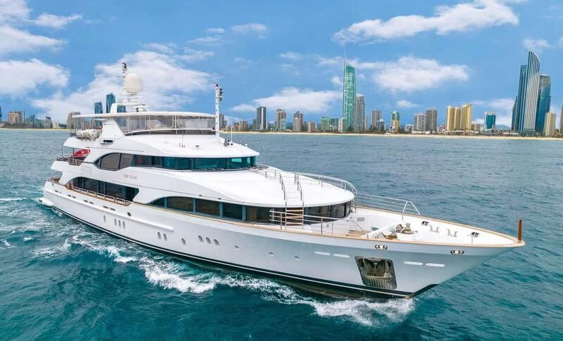 a white yacht in the water aboard THE STAR Yacht for Sale