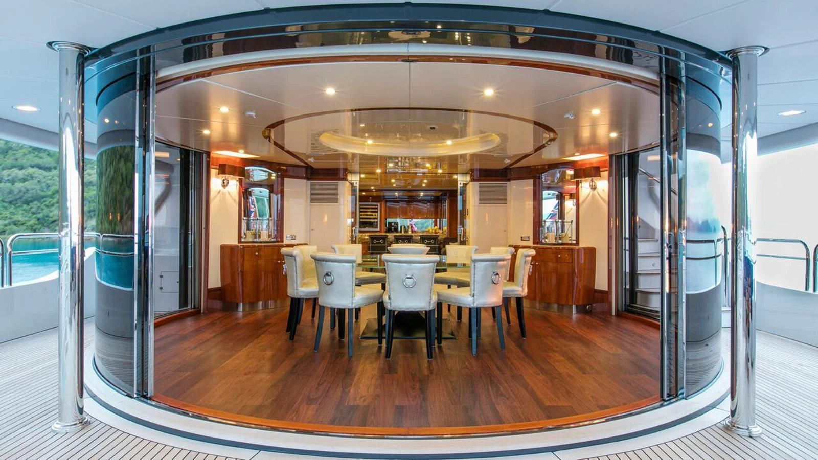 a large room with tables and chairs aboard THE STAR Yacht for Sale