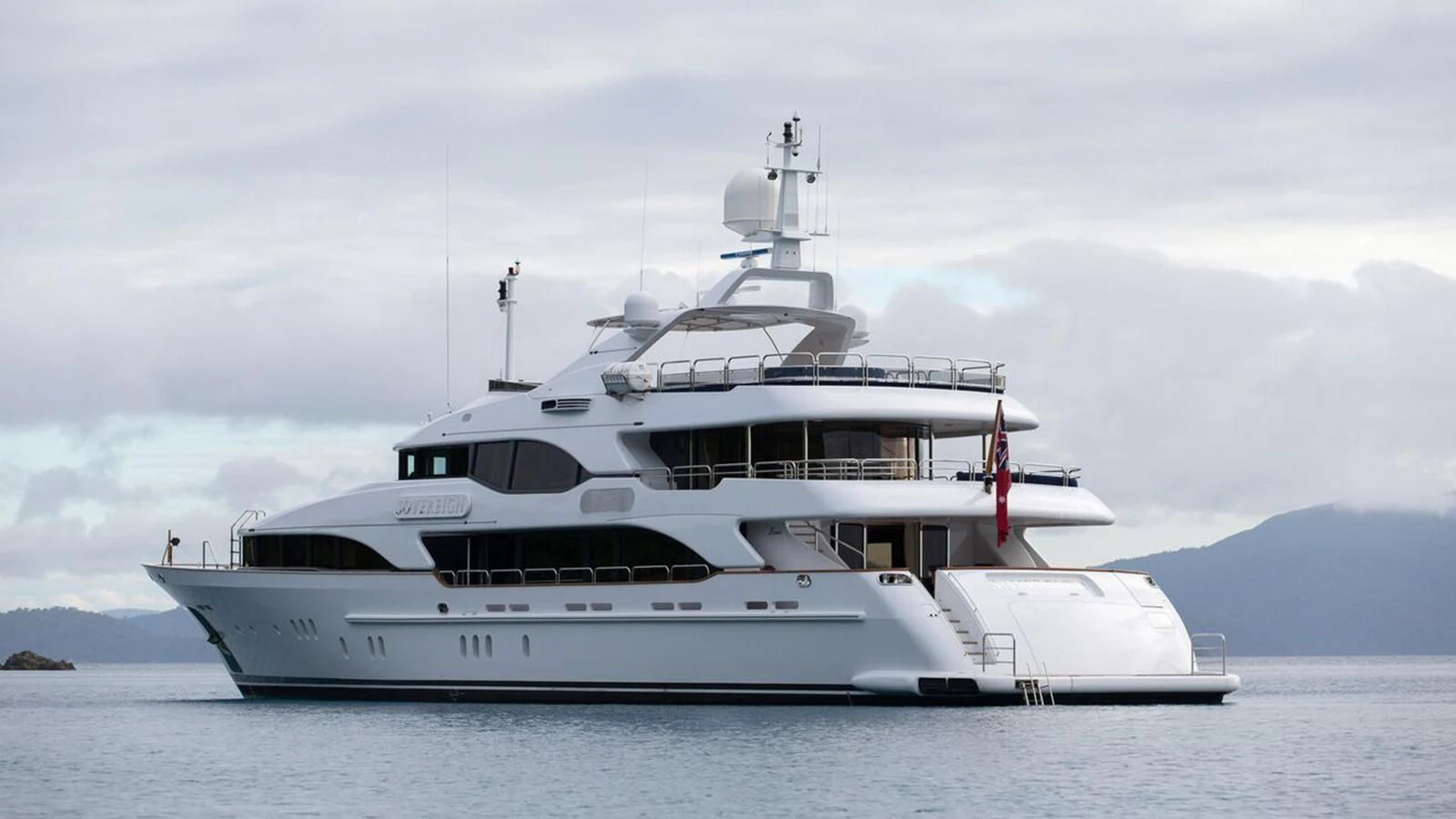 a white yacht in the water aboard THE STAR Yacht for Sale