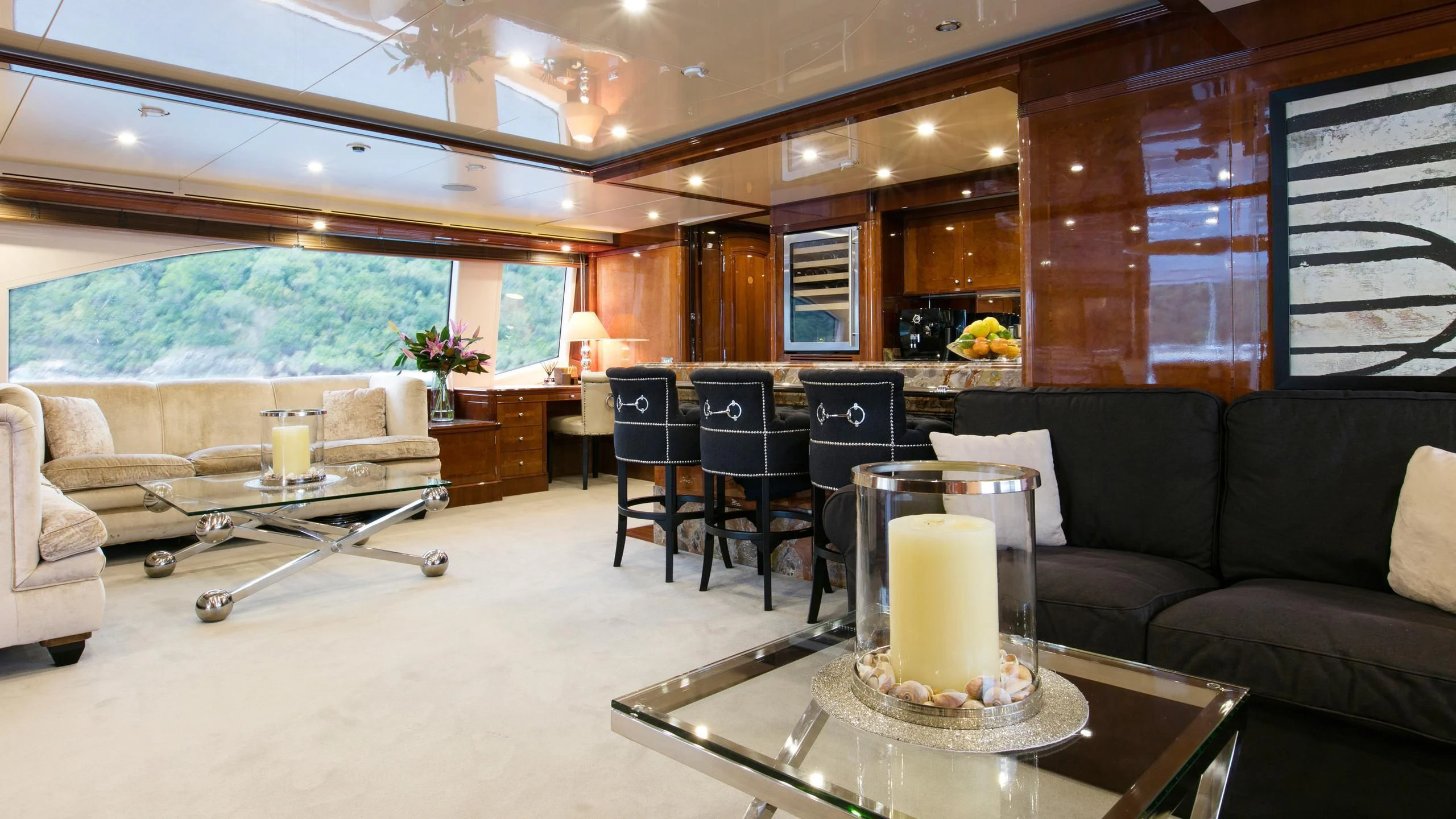 a living room with a large fireplace aboard THE STAR Yacht for Sale