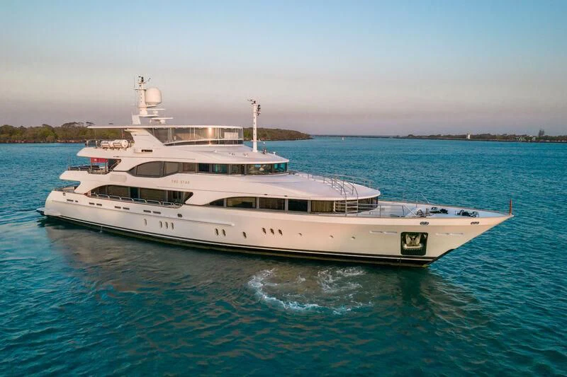 a white boat in the water aboard THE STAR Yacht for Sale