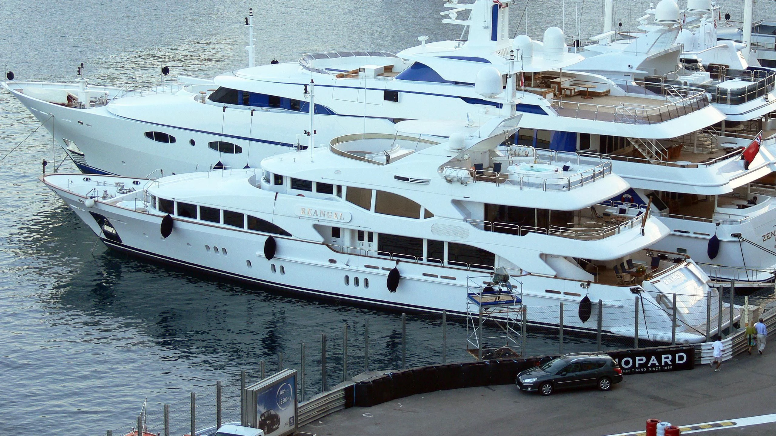 a large white boat docked aboard THE STAR Yacht for Sale