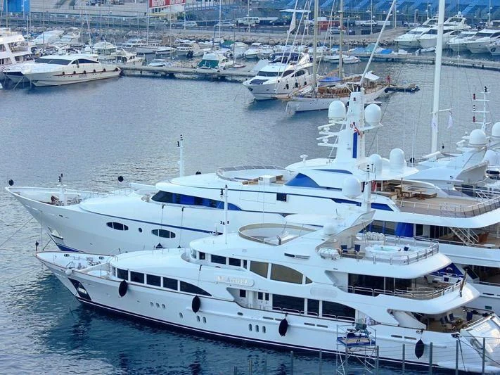 a group of yachts in a harbor aboard THE STAR Yacht for Sale