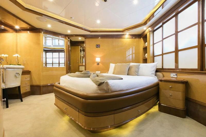 a large bedroom with a bed aboard THE STAR Yacht for Sale