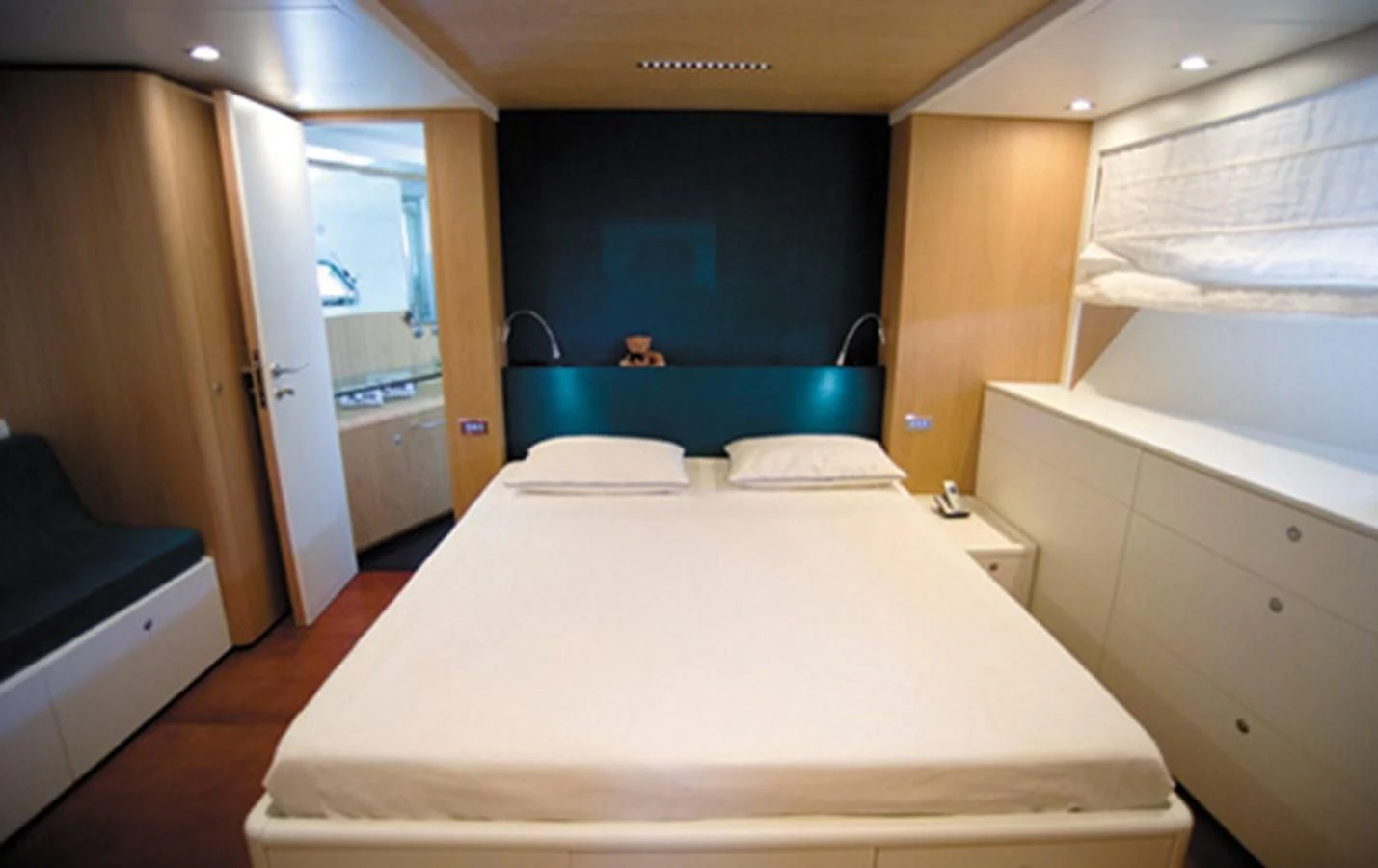 a room with a bed and a desk aboard CNM CONTINENTAL 80 Yacht for Sale