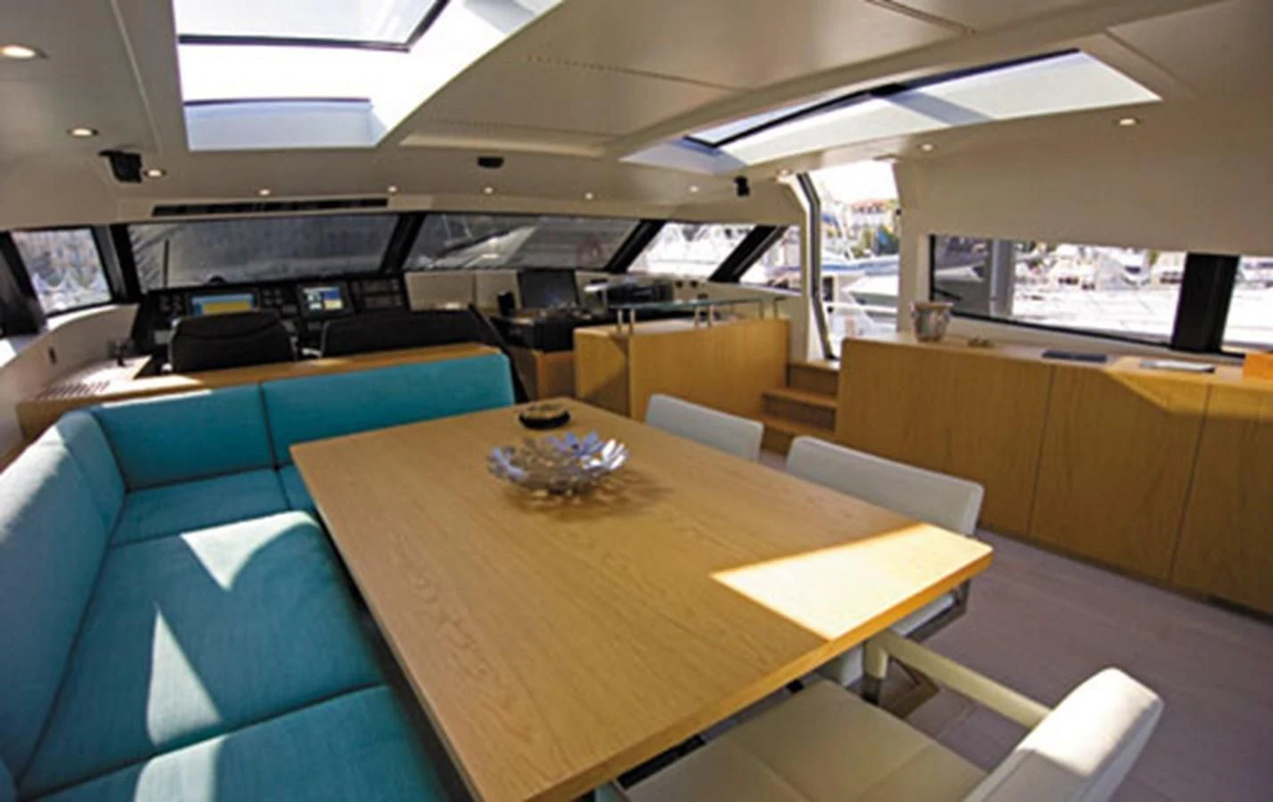 a room with a table and chairs aboard CNM CONTINENTAL 80 Yacht for Sale