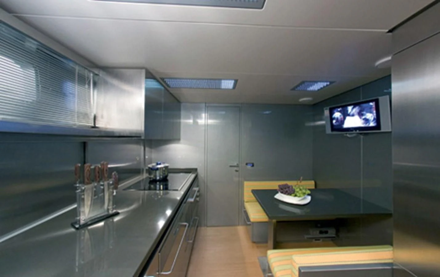 a kitchen with a large island aboard CNM CONTINENTAL 80 Yacht for Sale