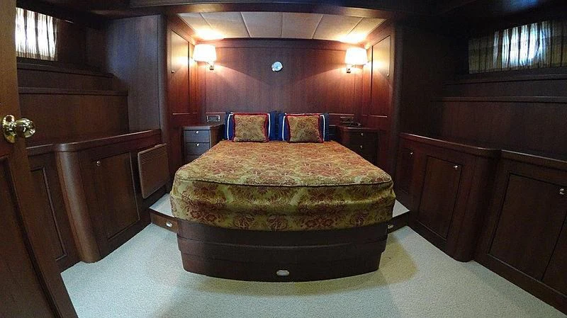 a bed in a room aboard KUYIS Yacht for Sale