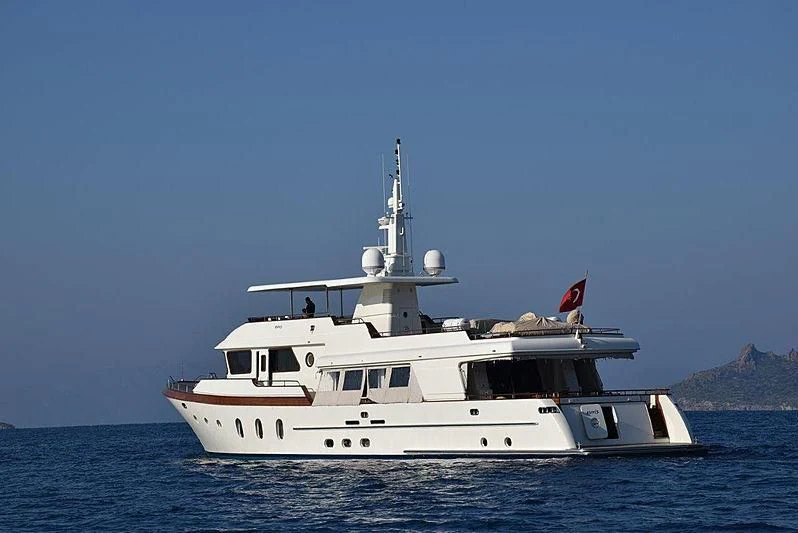 a large white boat in the water aboard KUYIS Yacht for Sale