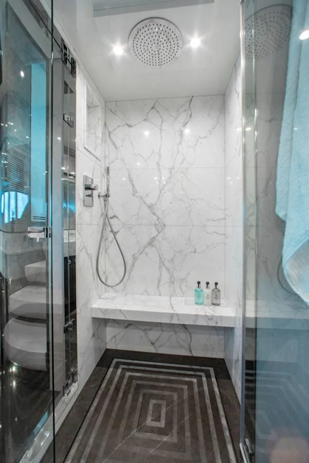 a bathroom with a shower aboard INDIGO Yacht for Sale