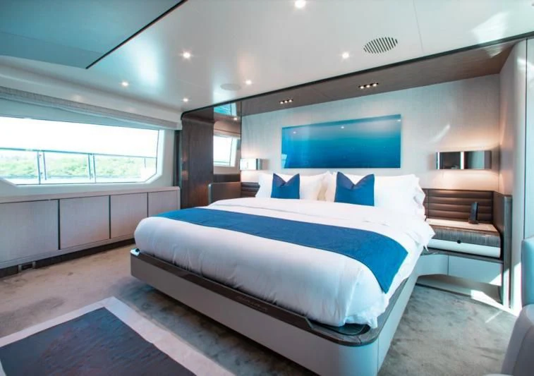 a large bed in a room aboard INDIGO Yacht for Sale