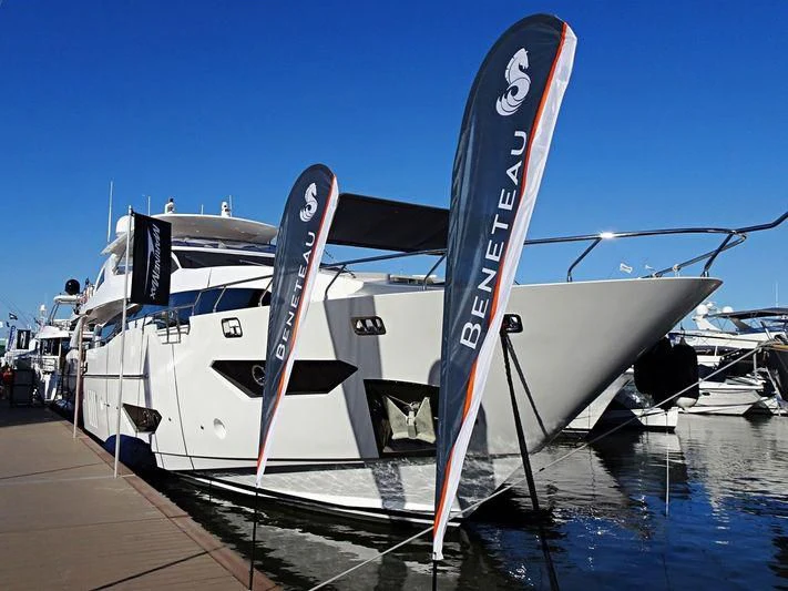 a boat with surfboards on the deck aboard INDIGO Yacht for Sale
